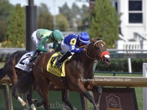 alt="Two horses battling to the wire at Churchill Downs"