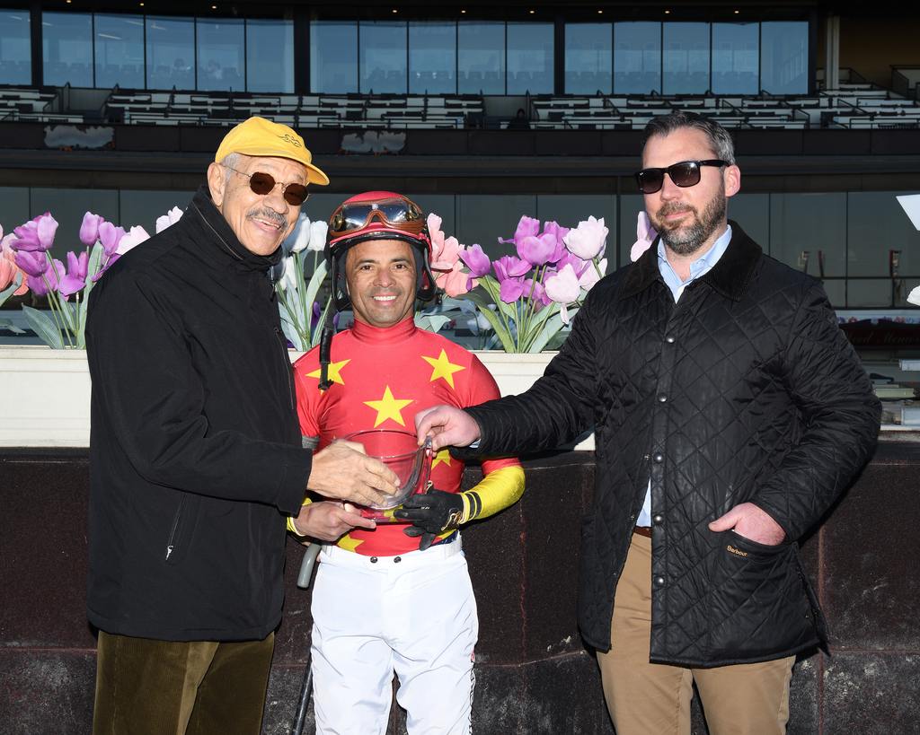 Sonny Taylor, of NYRA presents the Top Flight Trophy to Jockey Jose Lezcano, and Byron Hughes, Pletcher Assistant Trainer at Belmont (NYRA Coglianese)