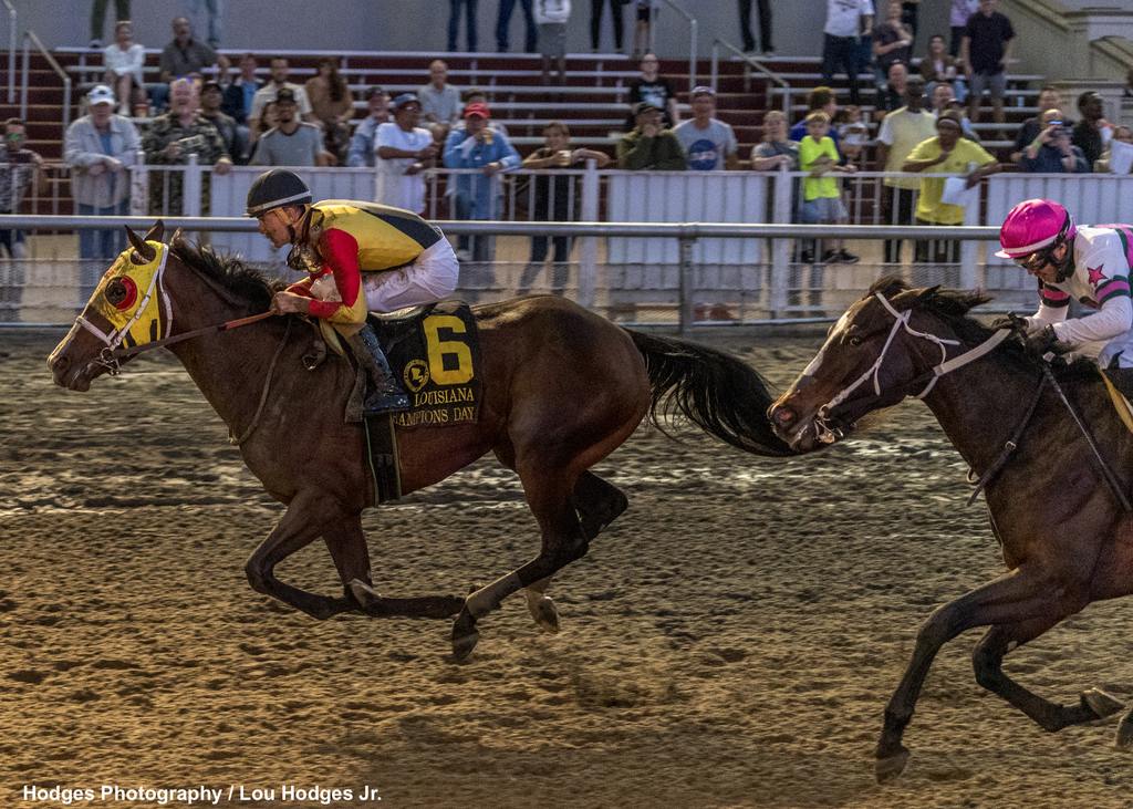 12/9/2023 - Jockey Brian Hernandez, Jr. makes a late charge to capture the 32nd running of the Louisiana Champions Day Lassie at Fair Grounds.  Hodges Photography / Amanda Hodges Weir