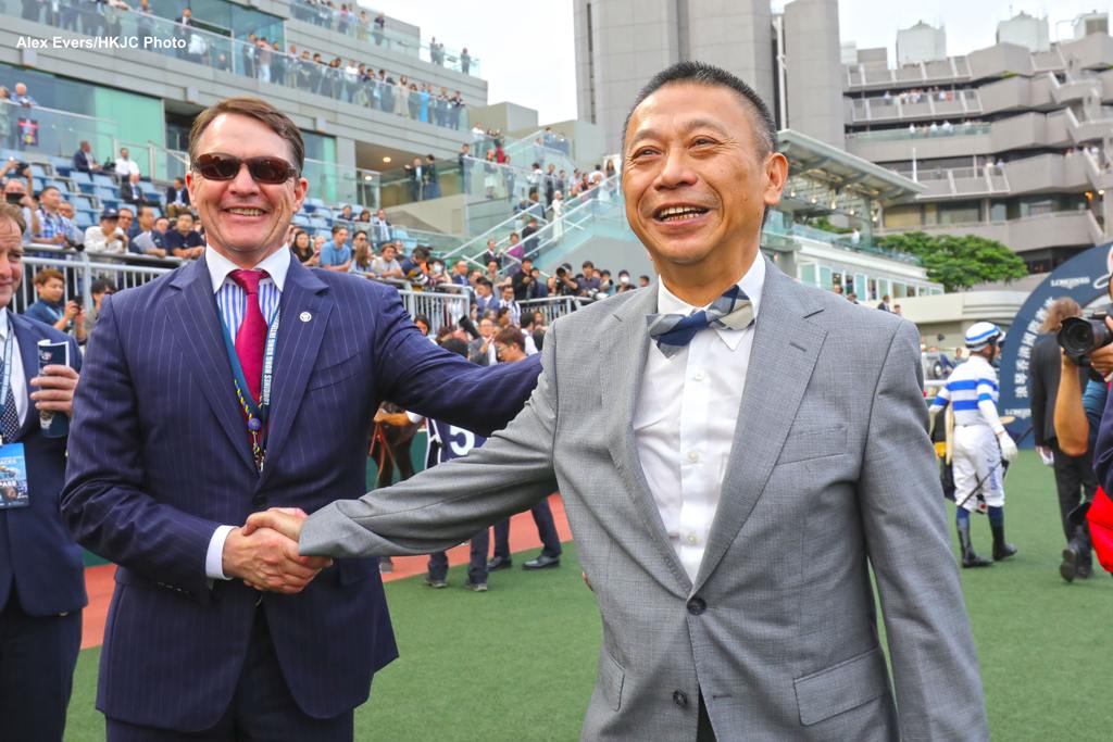 Danny Shum (right) celebrates. (Alex Evers/HKJC Photo)