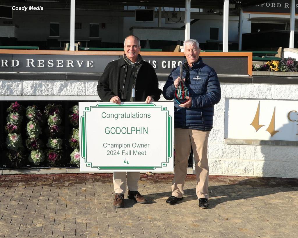 45 wins! Godolphin LLC's four 2024 meet titles in Kentucky included Churchill Downs fall meet. CD General Manager Mike Ziegler made the presentation to Godolphin's Director of Bloodstock Michael Banahan (holding trophy). (Coady Media)