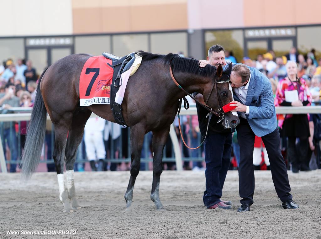 Trainer Doug O'Neill kisses Hot Rod Charlie after he won the $1,000,000 Grade 1 Pennsylvania Derby at Parx Racing in Bensalem, Pennsylvania on September 25, 2021. Photo By Nikki Sherman/EQUI-PHOTO