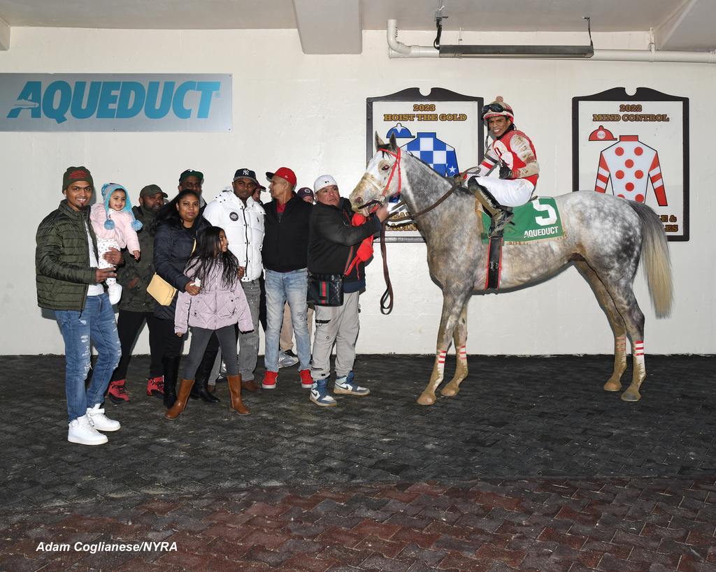 Jockey Favinho Villa Pino makes his first trip to the winner’s circle aboard Strong Light. (Adam Coglianese/NYRA)