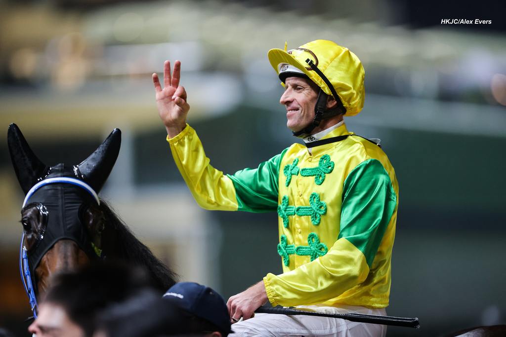 Hugh Bowman celebrates a double. (HKJC/Alex Evers)