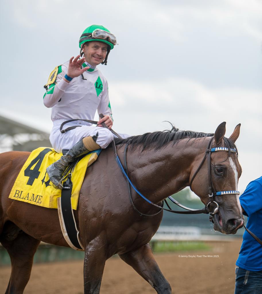 Brian Hernandez and Mystik Dan head to the winner's circle. (Jenny Doyle/Past The Wire)