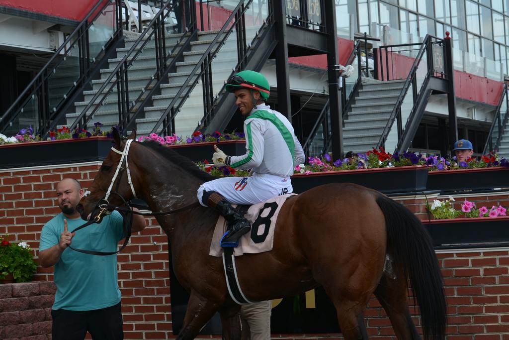 Bourbon Boss and Jaime Rodriguez celebrate in the winner's circle. (Barbara Singer/Past The Wire)