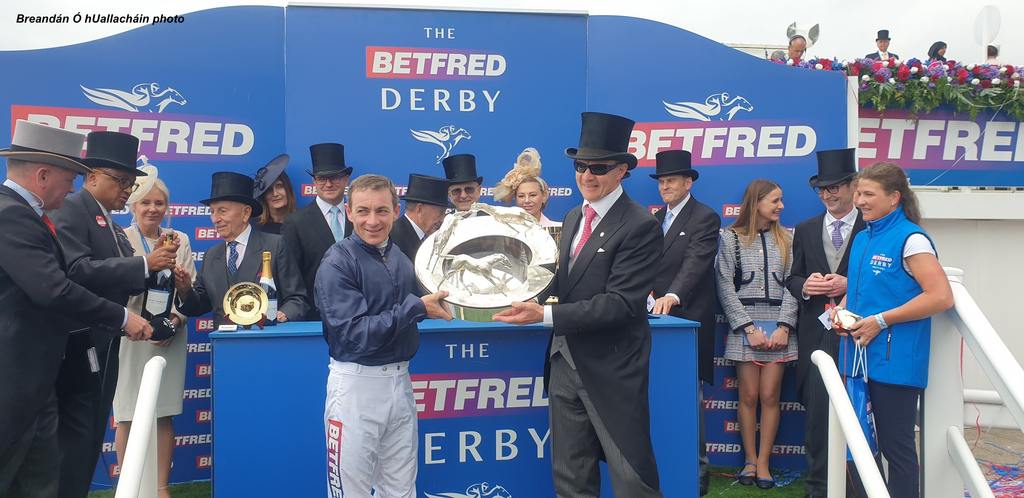 Jockey Wayne Lordan and trainer Aidan O'Brien hold the Betfred Derby Trophy aloft. (Breandán Ó hUallacháin photo)