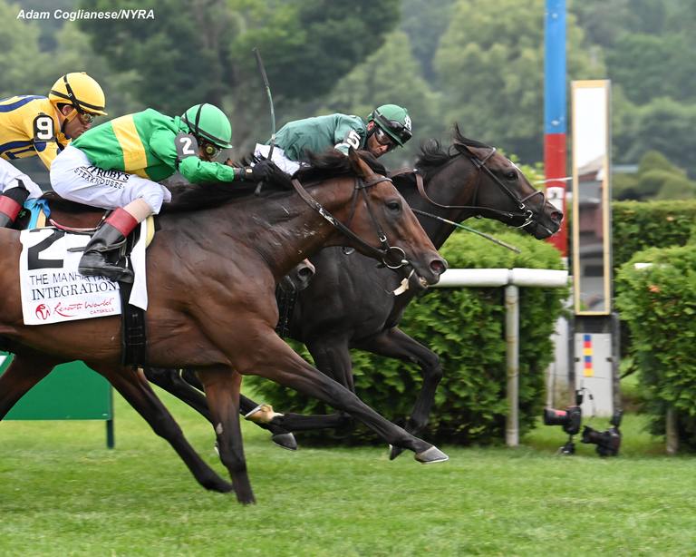 Deterministic hits the wire as Kendrick Carmouche checks his competition. (Adam Coglianese/NYRA)