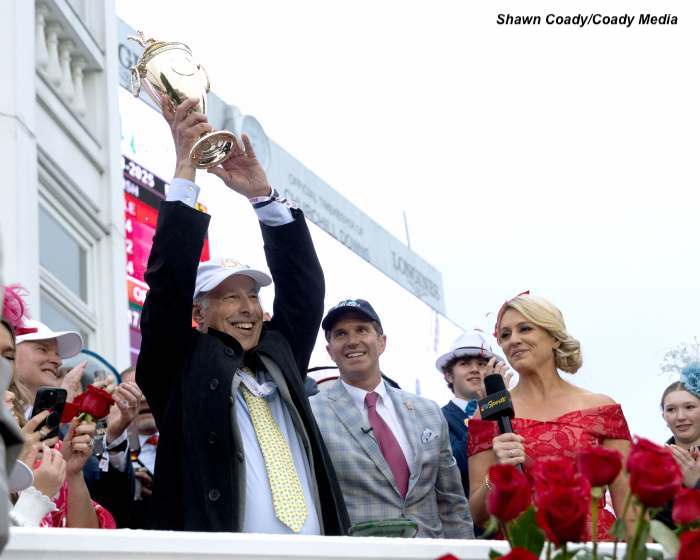 Michael Banahan, director of bloodstock for Godolphin USA, celebrates with the Kentucky Derby trophy after Sovereignty’s victory. (Shawn Coady/Coady Media)