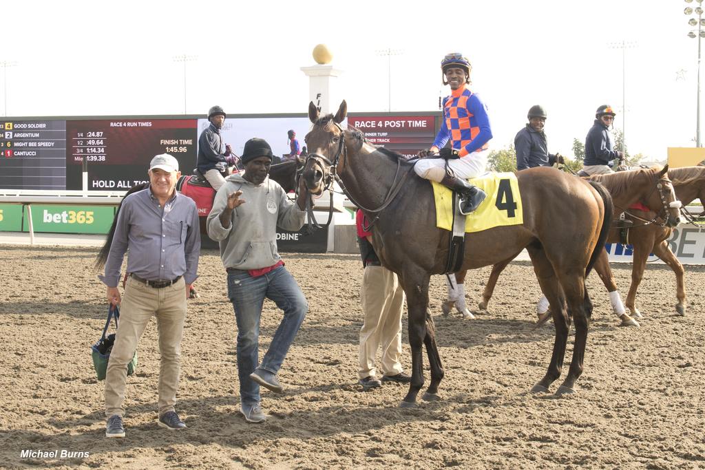 Sean Lewis mid-dance in the Woodbine winner’s circle with horse Good Soldier with owner/trainer Andrew Smith and jockey Keveh Nicholls, Oct. 11, 2024. (Michael Burns)