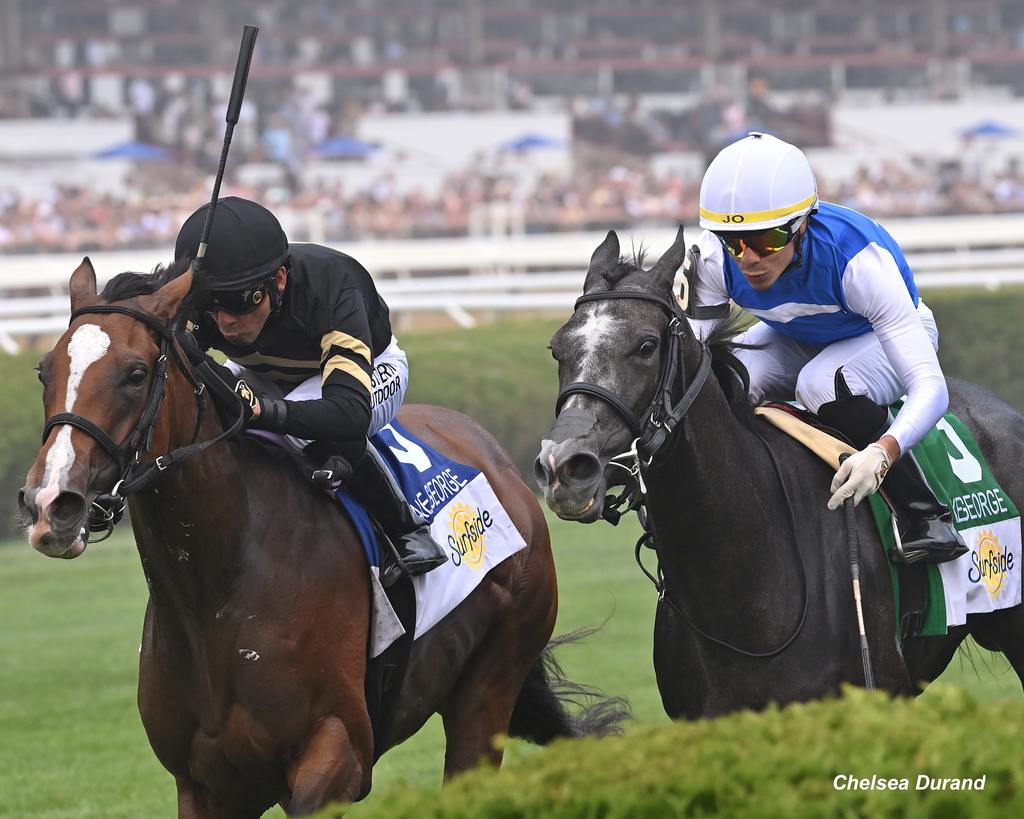 Classic Q (#5 inside) was still going strong though the turn with Daisy Flyer (outside #3) in close pursuit. (Chelsea Durand)
