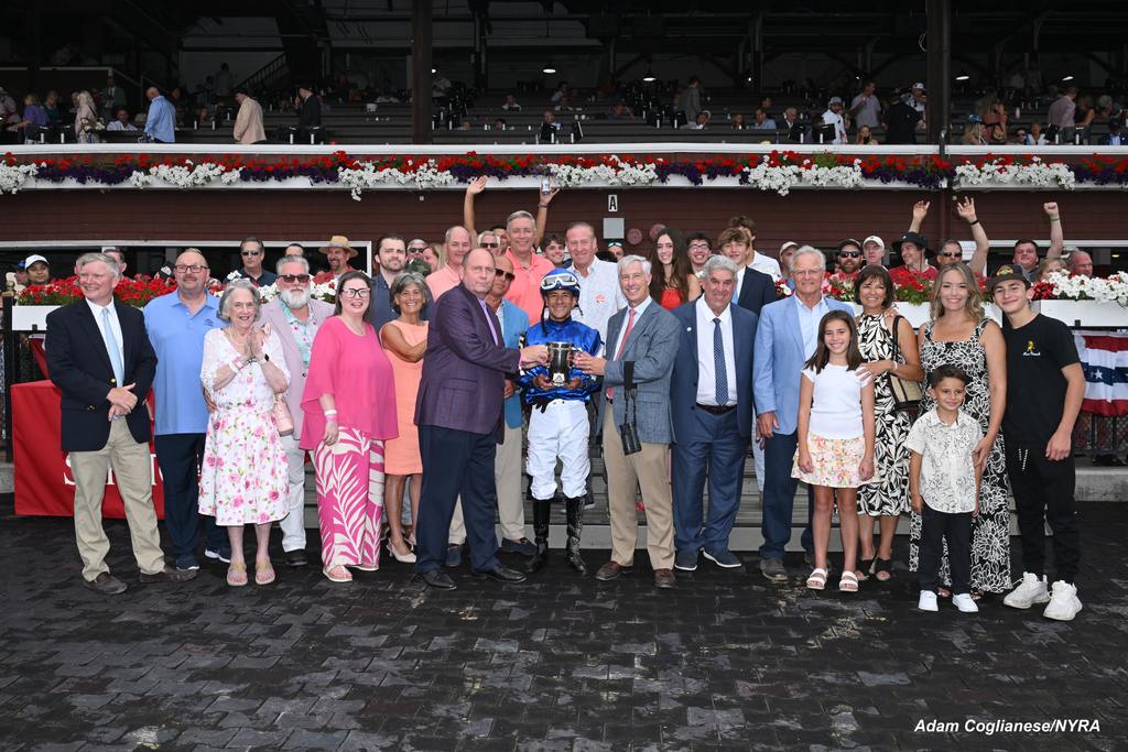 Alvarado with Sovereignty’s connections in the winner’s circle. (Adam Coglianese/NYRA)