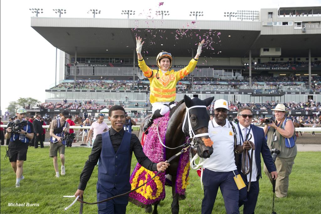 Mansetti and rising star Pietro Moran celebrate the victory with groom Lawrence Williams leading them. (Michael Burns)