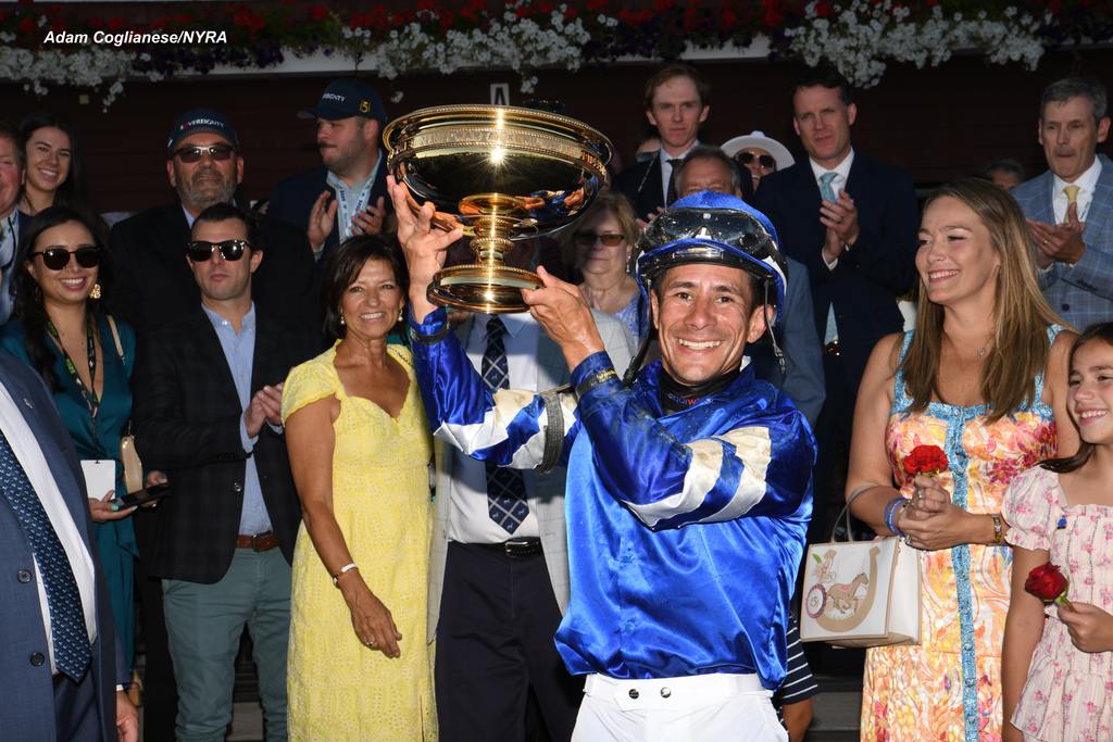 Hernandez hoists the trophy. (Adam Coglianese/NYRA)