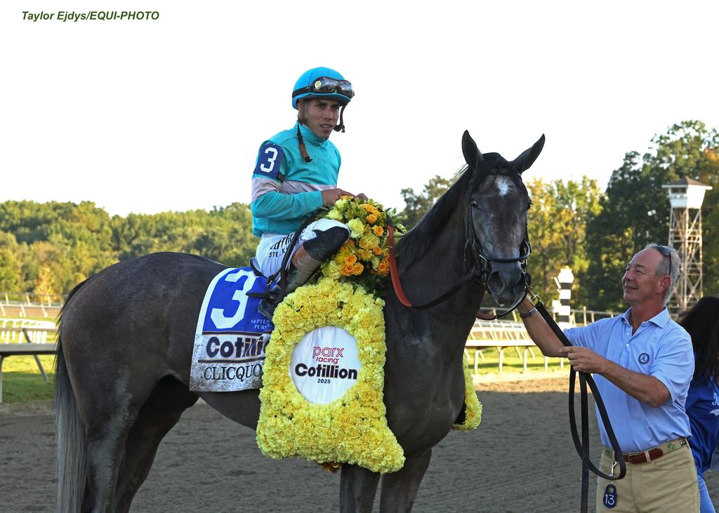 Roger Horgan greets Clicquot and jockey Irad Ortiz Jr. after their victory. (Taylor Ejdys/EQUI-PHOTO)