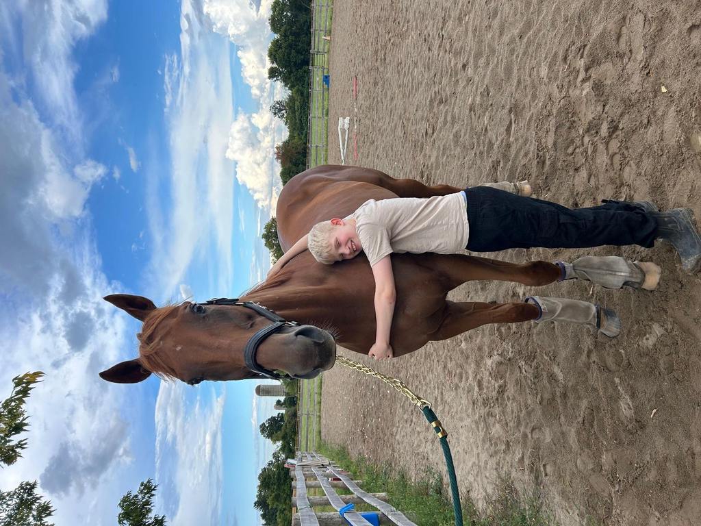 Nycola’s son Griffyn giving Klaus a hug. (Photo courtesy of Nycola Penfold)