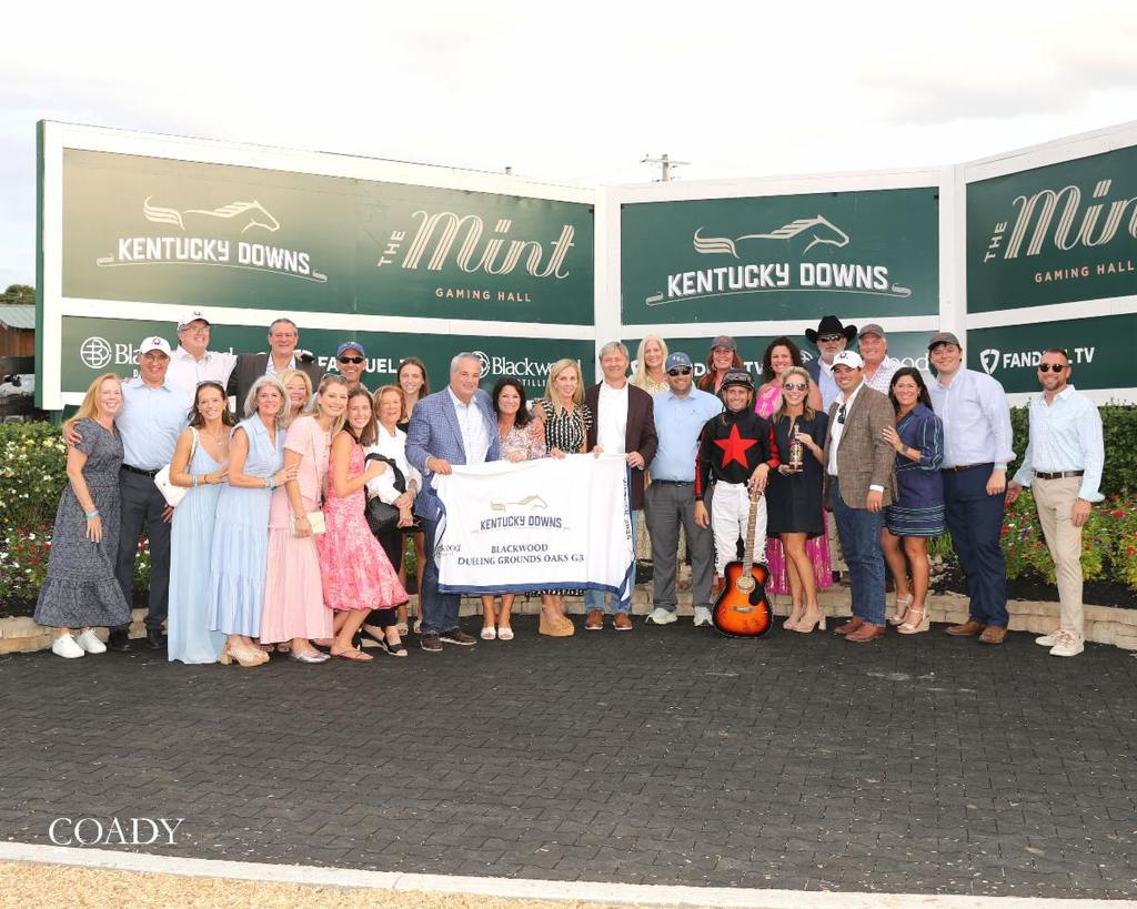 The happy winner's circle after Fionn's win. (Coady Media)