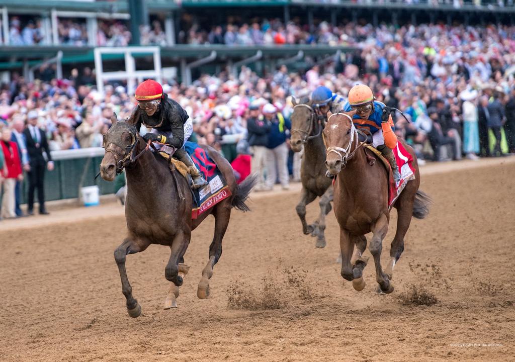 " A thrilling finish in the 152nd Kentucky derby between two brothers, two horses managing foot issues, the first female to win the race, a neck apart, Jenny Doyle, Past the Wire"