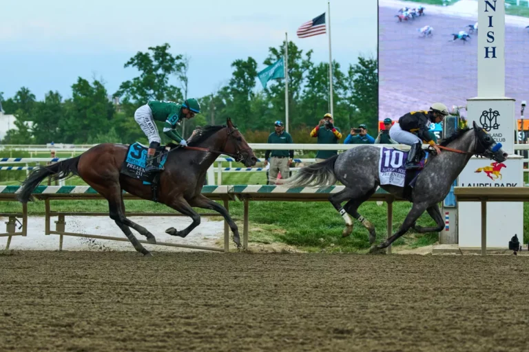 Paco Lopez, right, atop Napoleon Solo, edges out Iron Honor, ridden by Flavien Prat, to win the 151st running of the Preakness Stakes on Saturday at Laurel Park. (Stephanie Scarbrough / Associated Press)